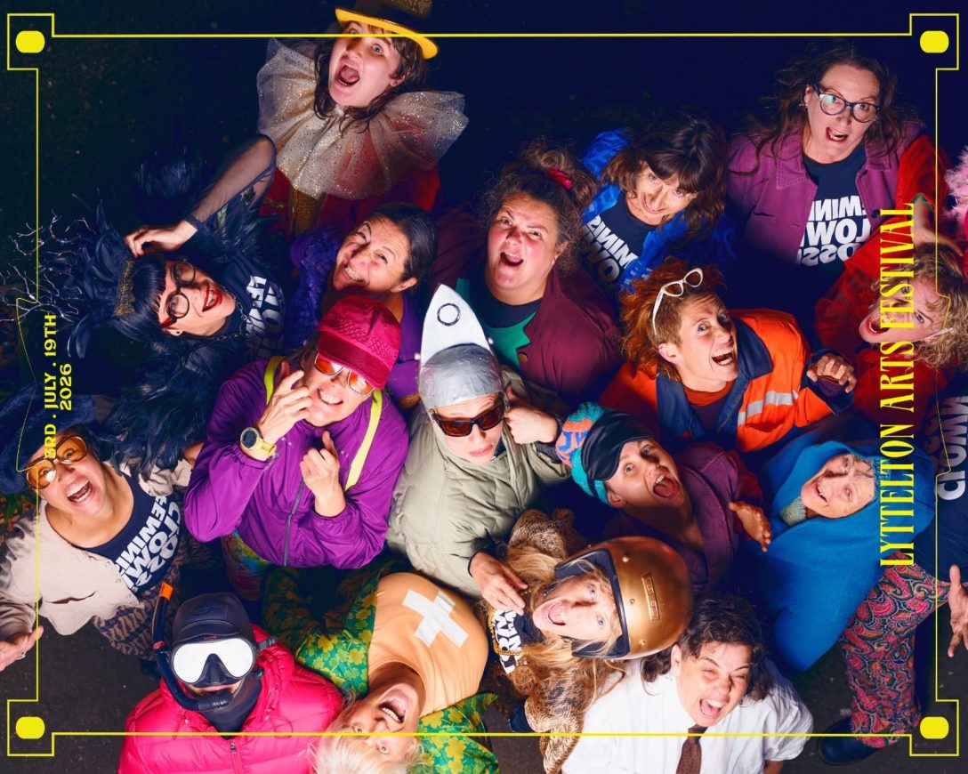 A bird's eye shot of lots of women in colourful costumes, looking up at the camera and making faces